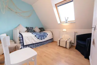 Ein Bett oder Betten in einem Zimmer der Unterkunft Ferienhaus Ostsee