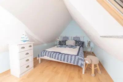 Ein Bett oder Betten in einem Zimmer der Unterkunft Ferienhaus Ostsee