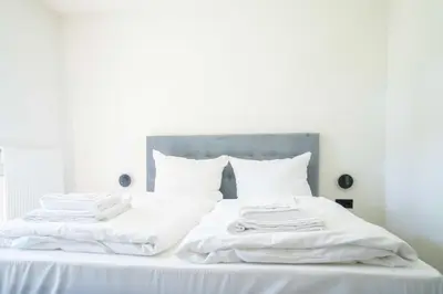 Ein Bett oder Betten in einem Zimmer der Unterkunft Johouse Zingst Johouse Zimmer 11