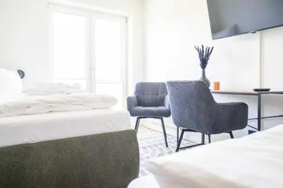 Ein Bett oder Betten in einem Zimmer der Unterkunft Johouse Zingst Johouse Zimmer 12