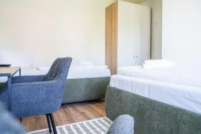 Ein Bett oder Betten in einem Zimmer der Unterkunft Johouse Zingst Johouse Zimmer 12