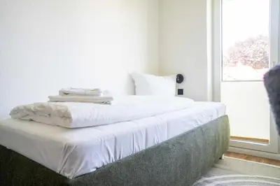 Ein Bett oder Betten in einem Zimmer der Unterkunft Johouse Zingst Johouse Zimmer 12