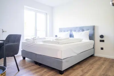 Ein Bett oder Betten in einem Zimmer der Unterkunft Johouse Zingst Johouse Zimmer 04