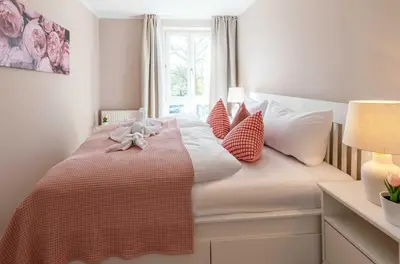 Ein Bett oder Betten in einem Zimmer der Unterkunft 5-Sterne-Apartment Heymat an der Seebrücke