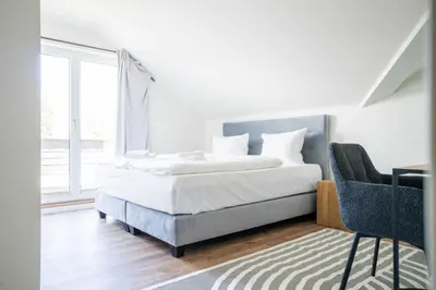 Ein Bett oder Betten in einem Zimmer der Unterkunft Johouse Zingst Johouse Zimmer 16