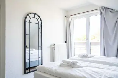 Ein Bett oder Betten in einem Zimmer der Unterkunft Johouse Zingst Johouse Zimmer 16