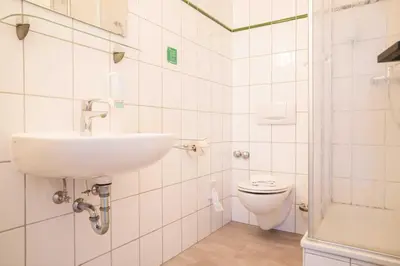 Ein Badezimmer in der Unterkunft Johouse Zingst Johouse Zimmer 16