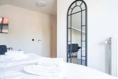 Ein Bett oder Betten in einem Zimmer der Unterkunft Johouse Zingst Johouse Zimmer 16