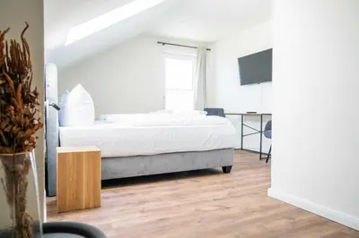 Ein Bett oder Betten in einem Zimmer der Unterkunft Johouse Zingst Johouse Zimmer 17