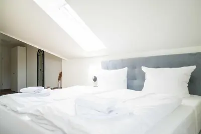 Ein Bett oder Betten in einem Zimmer der Unterkunft Johouse Zingst Johouse Zimmer 17