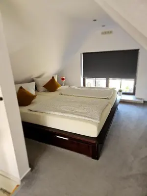 Ein Bett oder Betten in einem Zimmer der Unterkunft Ferienapartments Am Deich in Zingst