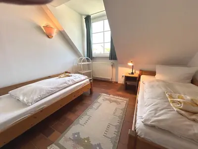 Ein Bett oder Betten in einem Zimmer der Unterkunft Resi P6