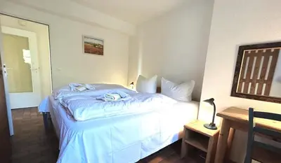 Ein Bett oder Betten in einem Zimmer der Unterkunft Resi M3
