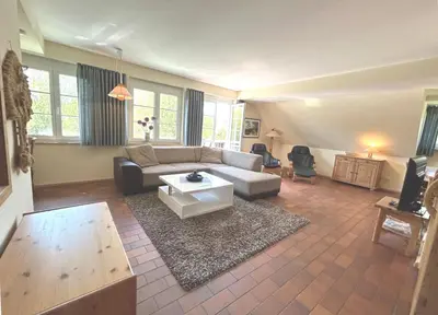 Ein Sitzbereich in der Unterkunft Resi C6