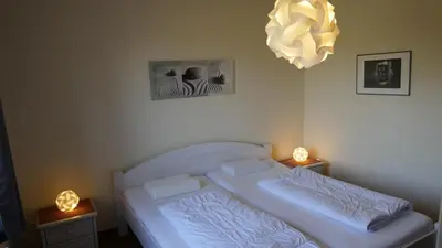 Ein Bett oder Betten in einem Zimmer der Unterkunft Ferienhaus Mantuja Wohnung I