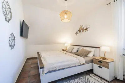 Ein Bett oder Betten in einem Zimmer der Unterkunft Rauchschwalbe