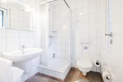 Ein Badezimmer in der Unterkunft Rauchschwalbe