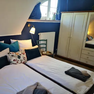 Ein Bett oder Betten in einem Zimmer der Unterkunft Sünneck