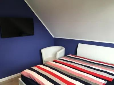 Ein Bett oder Betten in einem Zimmer der Unterkunft Steentje