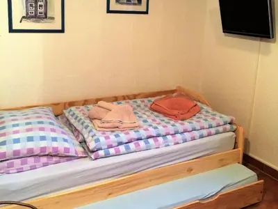 Ein Bett oder Betten in einem Zimmer der Unterkunft Walfisch