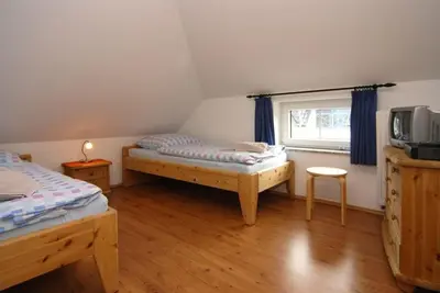 Ein Bett oder Betten in einem Zimmer der Unterkunft Walfisch