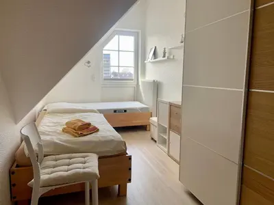 Ein Bett oder Betten in einem Zimmer der Unterkunft Ostseerose