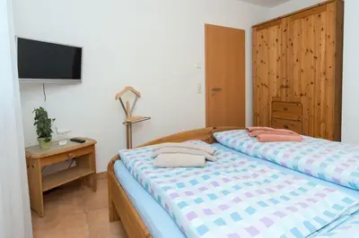 Ein Bett oder Betten in einem Zimmer der Unterkunft Leni