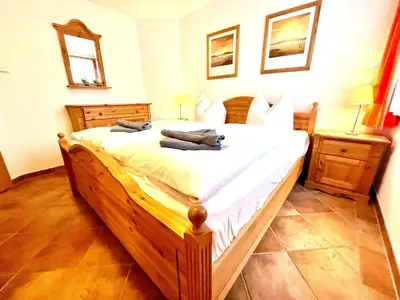 Ein Bett oder Betten in einem Zimmer der Unterkunft Victoria