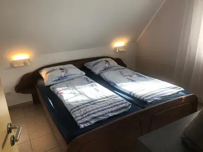 Ein Bett oder Betten in einem Zimmer der Unterkunft Kapitänsdeck