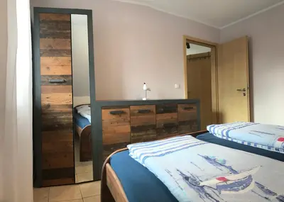 Ein Bett oder Betten in einem Zimmer der Unterkunft Kapitänsdeck