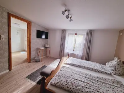 Ein Bett oder Betten in einem Zimmer der Unterkunft Pension & Wirtshaus ''Tun Eikkoter'' Kobel III