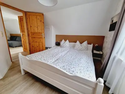 Ein Bett oder Betten in einem Zimmer der Unterkunft Pension & Wirtshaus ''Tun Eikkoter'' Eikboom