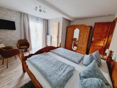 Ein Bett oder Betten in einem Zimmer der Unterkunft Pension & Wirtshaus ''Tun Eikkoter'' Kobel II