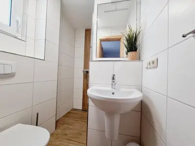 Ein Badezimmer in der Unterkunft Pension & Wirtshaus ''Tun Eikkoter'' Kobel II