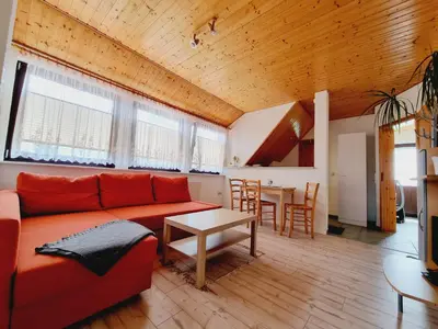 Ein Sitzbereich in der Unterkunft Pension & Wirtshaus ''Tun Eikkoter'' Eichkater