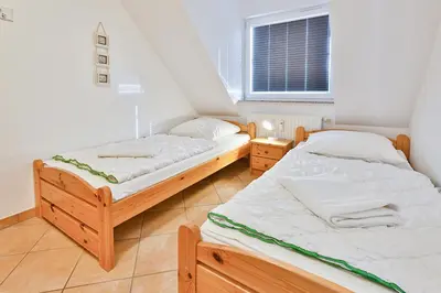 Ein Bett oder Betten in einem Zimmer der Unterkunft Ferienwohnung Nr 7