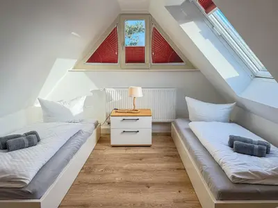 Ein Bett oder Betten in einem Zimmer der Unterkunft Darss - Duett 1