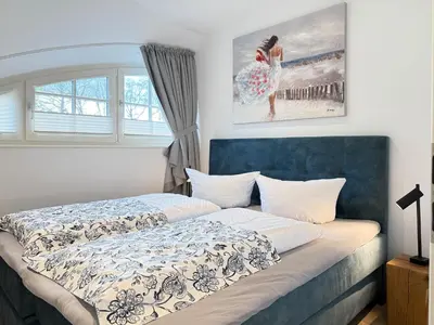 Ein Bett oder Betten in einem Zimmer der Unterkunft Darss - Duett 1
