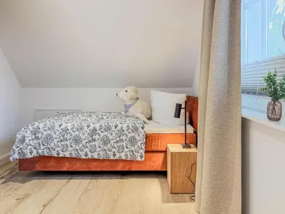 Ein Bett oder Betten in einem Zimmer der Unterkunft Darss - Duett 1