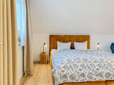 Ein Bett oder Betten in einem Zimmer der Unterkunft Darss - Duett 1