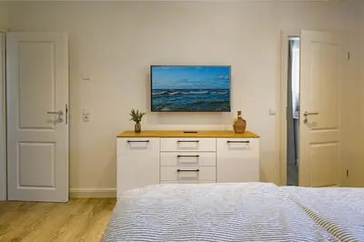 Ein Bett oder Betten in einem Zimmer der Unterkunft Darss - Duett 1
