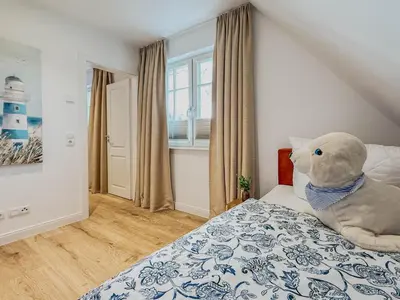 Ein Bett oder Betten in einem Zimmer der Unterkunft Darss - Duett 2