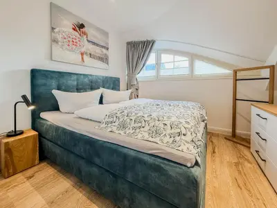 Ein Bett oder Betten in einem Zimmer der Unterkunft Darss - Duett 2