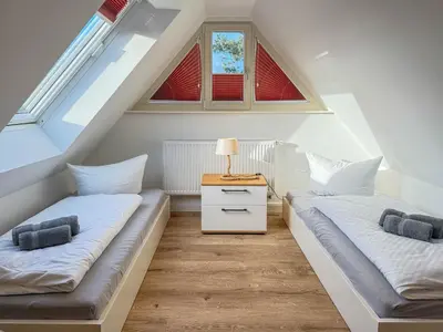 Ein Bett oder Betten in einem Zimmer der Unterkunft Darss - Duett 2