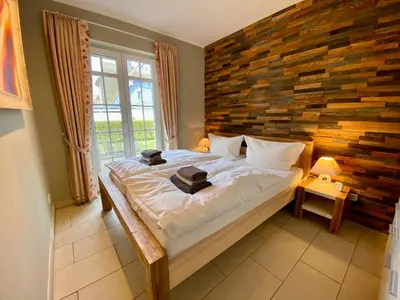 Ein Bett oder Betten in einem Zimmer der Unterkunft Ostsee Wellnessresidenz Wohnung 7 in Zingst