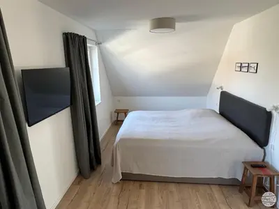Ein Bett oder Betten in einem Zimmer der Unterkunft Ferienhaus Hornhecht