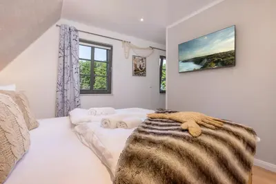 Ein Bett oder Betten in einem Zimmer der Unterkunft Ferienhaus Strandkajüte