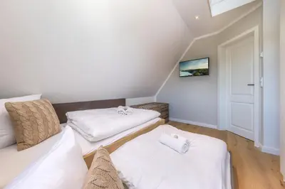 Ein Bett oder Betten in einem Zimmer der Unterkunft Ferienhaus Strandkajüte