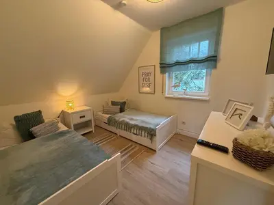 Ein Bett oder Betten in einem Zimmer der Unterkunft Villa Strandleben