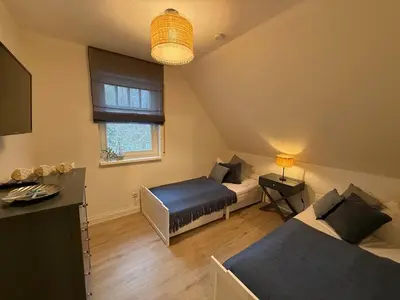 Ein Bett oder Betten in einem Zimmer der Unterkunft Villa Strandleben